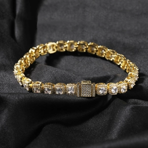 Close-up of hip hop golden tennis necklace with 7mm square cut cubic zirconia on black silk