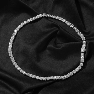 Macro shot of 7mm silver hip hop tennis necklace with cubic zirconia on black silk