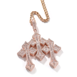 Detailed close-up of rose gold triple cross pendant with inset baguette zircon stones