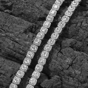 Macro shot of square-cut zircon tennis chain with iced-out links in monochrome style