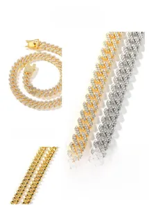 Detailed close-up of iced-out Cuban link chain with rhinestone inlay and security clasp