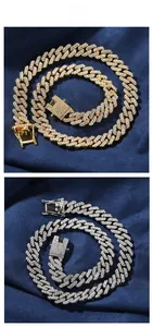 Macro shot of gold and silver cuban link chains with luxury crystal paving on the square clasp