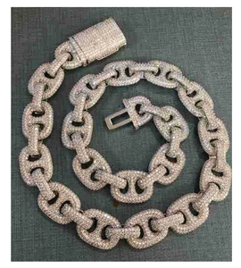 Detail of hip hop iced out silver mariner link chain with cubic zirconia pave settings