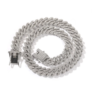 Detailed view of silver Cuban link chain with white zircon pavé and safety clasp