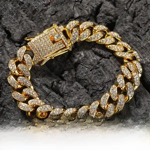 Close-up of 12mm gold alloy Cuban link bracelet with sparkling rhinestones and buckle
