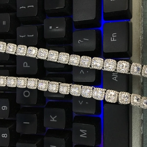 Macro shot of copper zircon hip hop chain featuring princess cut stones and halo setting