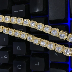 Detailed close-up of 7mm gold tennis chain with square-cut cubic zirconia and prong setting