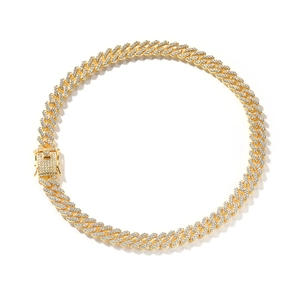 Close-up of golden hip hop Cuban link chain with sparkling diamond-set square clasp