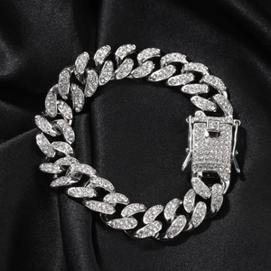 Iced out 12mm Cuban link bracelet for men with sparkling crystals on black silk background