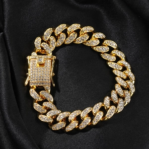 Close-up of 12mm hip hop gold plated Cuban chain bracelet with iced out pavé crystal clasp