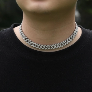 Hip-hop silver iced out Cuban link chain necklace with white stones worn by model