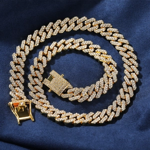 Hip hop golden Cuban link chain necklace with sparkling crystals on blue velvet