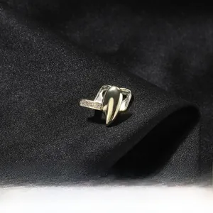 Detail of hip hop single tooth grillz made of gold copper with sparkling zircon stones