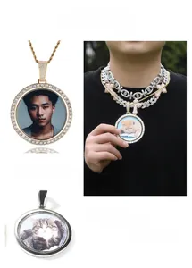 Close-up of iced-out spinning round photo locket with gold and silver finishes