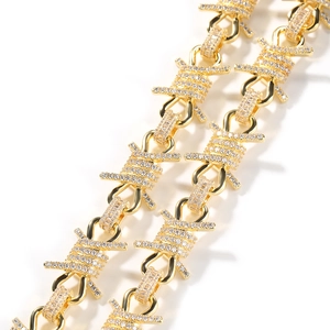 Macro detail of gold barbed wire chain with pavé diamonds in punk hip-hop style