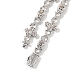 Iced-out hip hop necklace with cross and eye design and cubic zirconia pavé setting