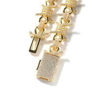 Macro view of hip hop gold-plated thorn link necklace with cubic zirconia pave