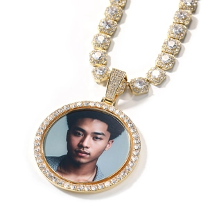 Close-up of hip hop rotating photo pendant with iced out crystals and tennis chain