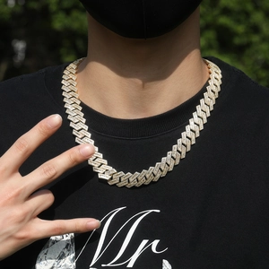 Close-up of 18mm golden hip-hop Cuban link necklace with T-shape pave cubic zirconia stones