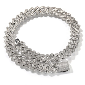Macro shot of silver hip-hop cuban chain with baguette-cut and pave zircon stones