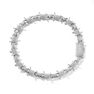 Close-up of hip hop barbed wire necklace with pavé diamonds and box clasp design