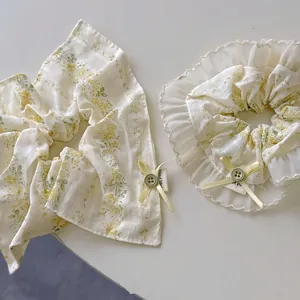 Floral bow scrunchie set in cream yellow with lace edges for Korean hair styling