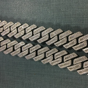 Close-up of 18mm Cuban link necklace featuring handset baguette and round cut zircons