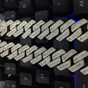 Professional close-up of an 18mm iced out Cuban link chain necklace with baguette zircons