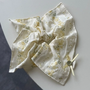 Detail of floral scrunchie with lace trim, green ribbon bow and Hand Made tag