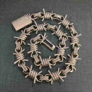 Detail of hip hop barbed wire necklace in rose gold with shimmering crystal inlay