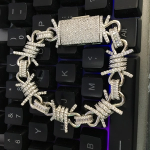 Detailed macro view of silver hip-hop thorn link bracelet with sparkling rhinestones