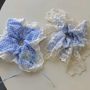 Sea salt blue plaid scrunchie set with white lace trim and ribbon bow for hair styling