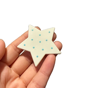 Cute star-shaped hair clip in milky white with blue polka dots for women and girls