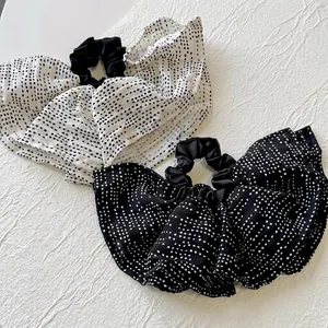 Elegant oversized polka dot hair scrunchies in black and white flowing chiffon fabric