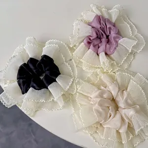 Elegant oversized lace scrunchie set in black, purple, and beige with wavy lace trim edges