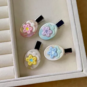 Set of four sweet floral acetate duckbill hair clips in pastel colors for women