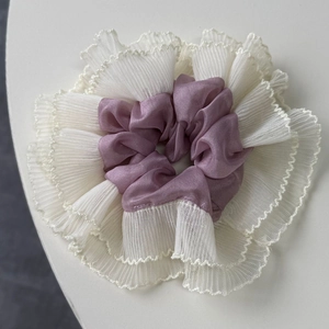Purple satin hair scrunchie with white lace trim and elegant ruffled texture for women