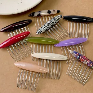 Vintage oval acetate hair combs set with gold metal teeth in ten assorted colors