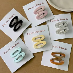 Barrettes ovales évidées en acétate en six couleurs avec lettrage doré chic