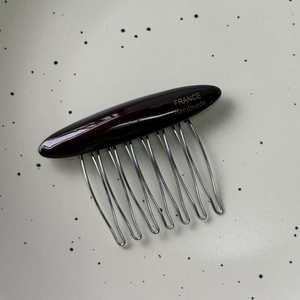 Handmade dark red acetate hair comb with silver metal teeth for elegant styling
