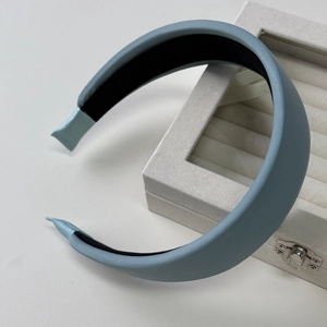 Minimalist light blue padded sponge headband with soft matte fabric for high cranial top look