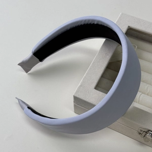 Detailed close-up of light purple wide satin headband with black non-slip inner lining