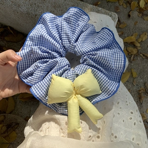 Blue plaid oversized scrunchie with a yellow bow tie for ballet style ponytail hair