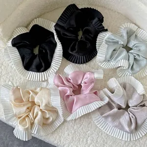 Set of five silk satin scrunchies with pleated ruffle edges in multiple neutral colors