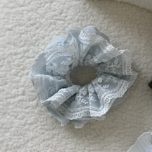 Elegant French style blue organza hair scrunchie with white floral lace trim on soft fabric