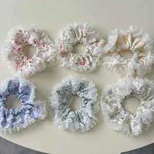 Set of 6 floral lace scrunchies in various patterns for hair styling and ponytails