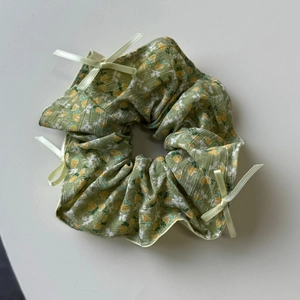 Sage green floral scrunchie with mini ribbon bows and vintage pleated fabric texture