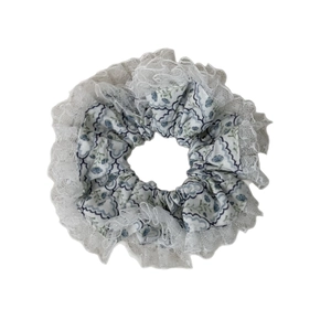 Light blue floral scrunchie with delicate white lace trim for elegant ponytail styling