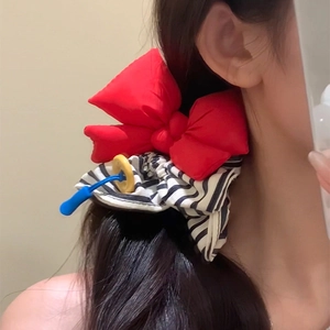 Red bow hair scrunchie with black white stripes and blue yellow drawstring charm