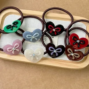 Chouchous cœur en acétate avec nœuds en strass et bandes élastiques en plusieurs couleurs